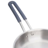 Stainless steel frying pan with a blue handle on a white background