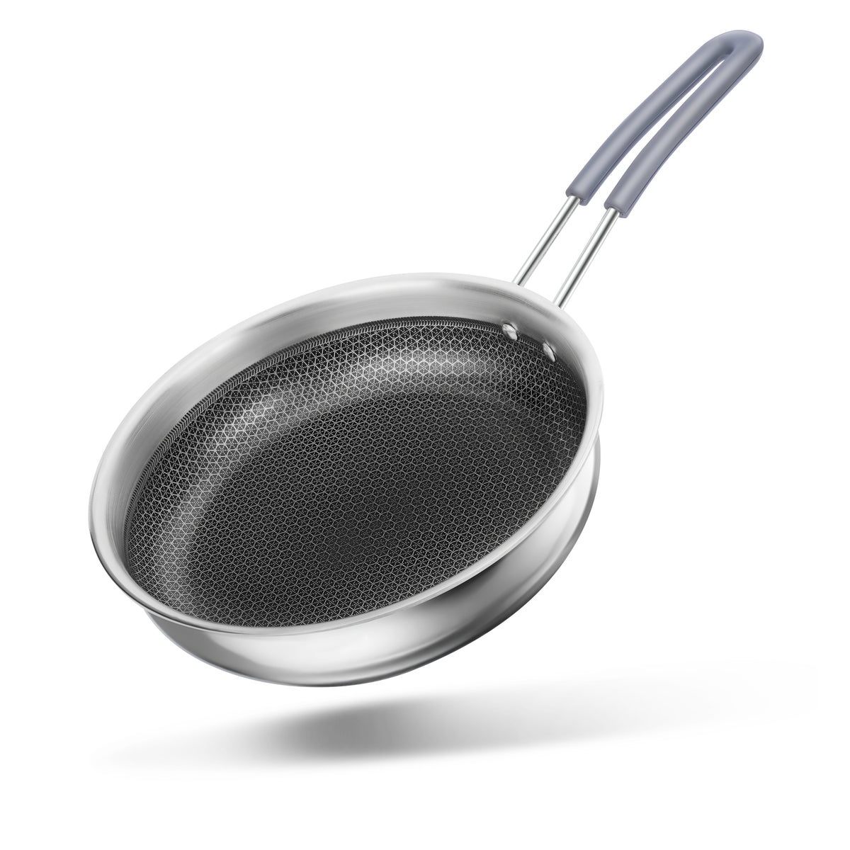 Stainless steel frying pan with a textured surface on a white background. signature triply honeycomb frypan. stainless steel triply honeycomb frypan with heat free handles, induction safe, 