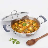 Stainless steel cookware with a curry dish inside, featuring the brand 'Saluto'.